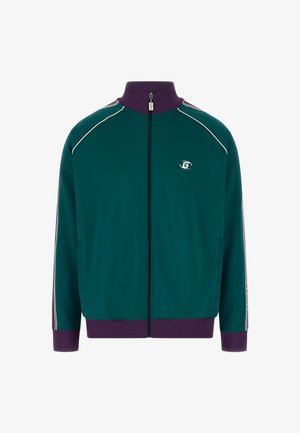 Zelená bunda na zips s vysokým golierom, biele pruhy na rukávoch a rebrované fialové manžety. V prednej časti sa nachádza logo.