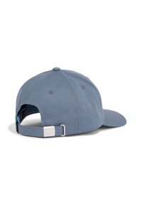 Blue cotton baseball cap with a curved brim. Features adjustable strap with metal buckle at the back and textured fabric.