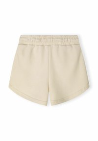 Pantalones cortos de algodón beige con cinturilla elástica, que presentan una textura suave y un diseño de dobladillo curvado para facilitar el movimiento.
