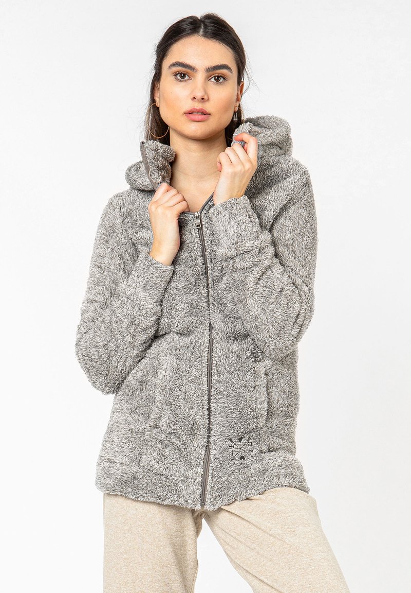 Gray fuzzy zip-up hoodie with a hood, featuring two front pockets and a soft texture. The design includes a patterned accent near the hem.