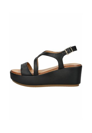 Black wedge sandals with a smooth leather upper, open toe, cross-strap design, adjustable ankle strap, and a durable brown rubber sole.