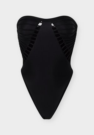 Strapless black one-piece swimsuit with ruched detailing and side cutouts featuring horizontal strap accents.