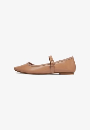 Tan leather ballet flats with a rounded toe, a thin ankle strap, and a smooth texture. Flat sole and minimalistic design elements.