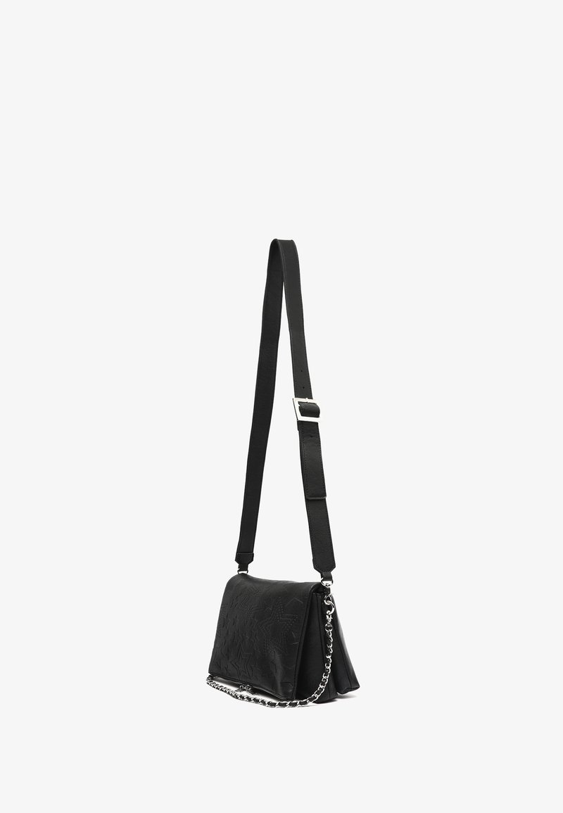 Black shoulder bag with embossed star patterns, adjustable leather strap with buckle, and silver chain detail on white background.