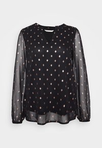 Blouse noire avec manches longues transparentes, col en V et motif à pois couleur or rose. Tissu léger, coupe légèrement ample, poignets froncés.