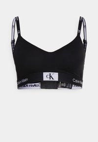 Sorth bralette med V-hals-design, laget av myk stoff. Den har justerbare stropper og et logobånd med svart og hvite detaljer.