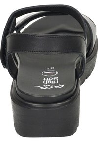 Sandali platform neri con tomaia in pelle liscia, doppie cinghie e soletta imbottita. Presenta una suola interna contrassegnata con la taglia 37.