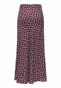 Jupe bordeaux à pois blancs, en tissu lisse. Silhouette trapèze avec un design fluide, dotée d'une taille haute.