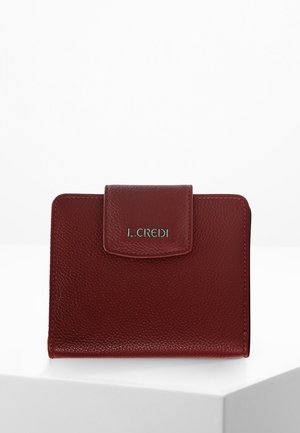 Red textured leather wallet with a flap closure and silver logo. Square shape, minimalistic design, and visible stitching detail.