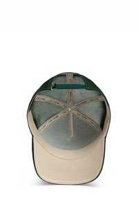 Green and beige cap with a structured visor. Interior features mesh lining and a circular metal snap, labeled with "THE FARM" pattern.