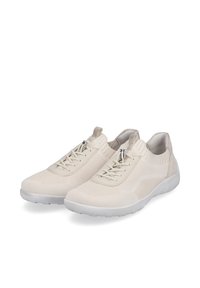 Beige, leichte Sneakers mit einem strukturierten Strickoberteil, elastischen Schnürsenkeln und einem silbernen Reißverschluss-Akzent. Die flexible Gummisohle sorgt für Grip.