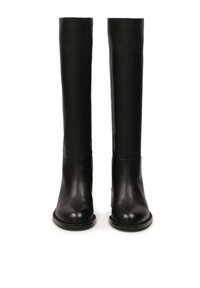 Knee-high black leather boots with a smooth texture and rounded toe, featuring a minimalistic design and subtle stitching detail along the sole.