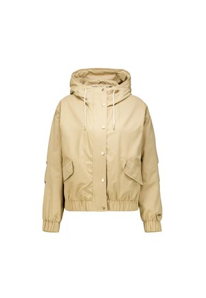 Veste beige courte avec capuche, équipée de fermetures à pression, cordons de serrage et deux poches avant. Tissu doux avec poignets et ourlet élastiqués.