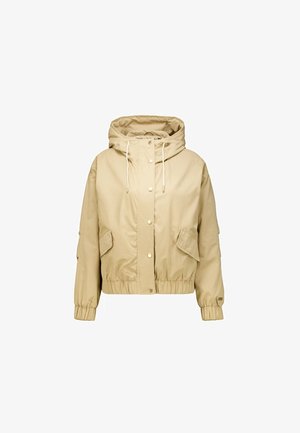 Veste beige courte avec capuche, équipée de fermetures à pression, cordons de serrage et deux poches avant. Tissu doux avec poignets et ourlet élastiqués.