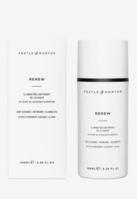 Weiße Boxverpackung und zylindrische Flasche mit schwarzen Akzenten. Der schwarze Text enthält Produktdetails. Das Etikett gibt eine Größe von 100ml an.