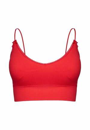 Czerwona bezszwowa braletka z cienkimi regulowanymi ramiączkami, koronkową lamówką na górnych krawędziach oraz małymi kokardkami przy mocowaniach ramiączek, na białym tle.