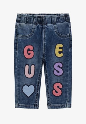 Modri jeans s elastičnim pasom, ki imajo velike večbarvne filc črke in srčni motiv na spodnjem levem delu nogavice.