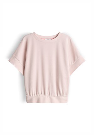 Maglietta rosa chiaro a maniche corte in maglia a costine, con scollo rotondo e fascia aderente in vita, mostrata distesa su uno sfondo bianco.