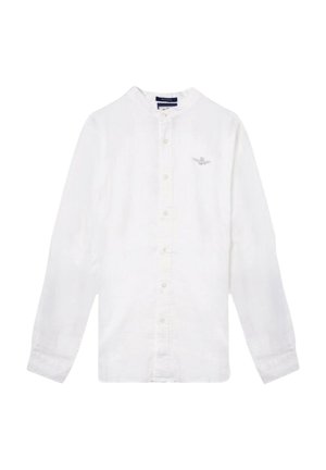 Camicia bianca a maniche lunghe in lino con colletto alla francese, chiusura frontale a bottoni e logo ricamato sul lato sinistro del petto. Tessuto morbido e texturizzato.