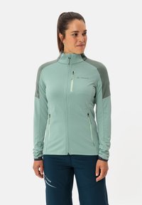 Hellgrüne Zip-Jacke mit hohem Kragen, mit grauen Akzenten auf den Schultern, einem mit Reißverschluss versehenen Brusttasche und Seitentaschen. Glatte Textur.
