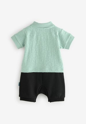 Polo stil rompers u mint zelenom teksturiranom materijalu, s donjim dijelom u čvrstoj crnoj boji. Rebrasti ovratnik i kratki rukavi, mješavina pamuka.