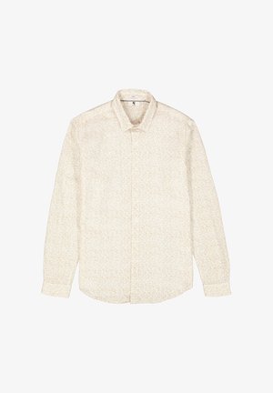 Camisa de botones beige clara con un sutil patrón floral. Mangas largas, textura suave y un diseño clásico de cuello.