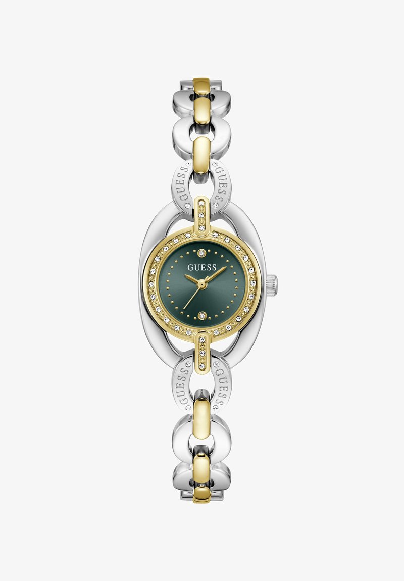 Γυναικείο ρολόι Guess με χρυσούς και ασημένιους κρίκους αλυσίδας, πράσινο καντράν, κρύσταλλα γύρω από το μπ bezel και το λογότυπο Guess στο καντράν και τους κρίκους.
