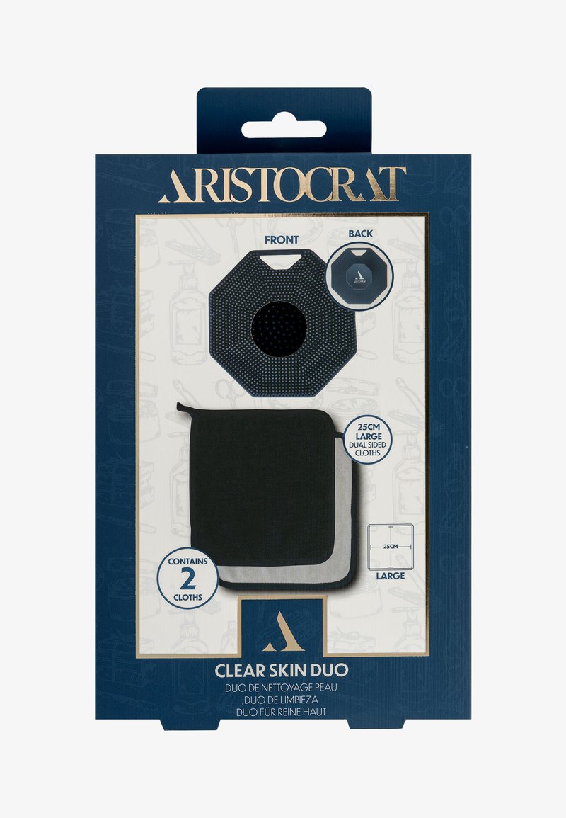 Zestaw dwóch ściereczek do oczyszczania Clear Skin Duo zapakowanych w granatowe opakowanie ze złotymi akcentami. Zawiera dwie dwustronne ściereczki o wymiarach 25 cm; zawiera szczegóły dotyczące tekstury i koloru.