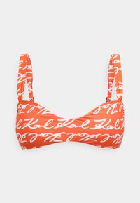 Pomarańczowy top bikini z białym wzorem tekstu w stylu odręcznego pisma. Projekt obejmuje cienkie ramiączka i gładką teksturę tkaniny.