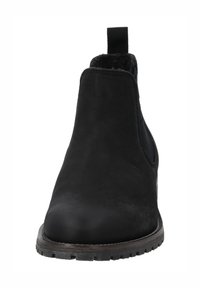 Botines Chelsea de ante negro con paneles laterales elásticos, diseño de puntera redonda y suela de goma texturizada. Incluye una lengüeta en el talón.