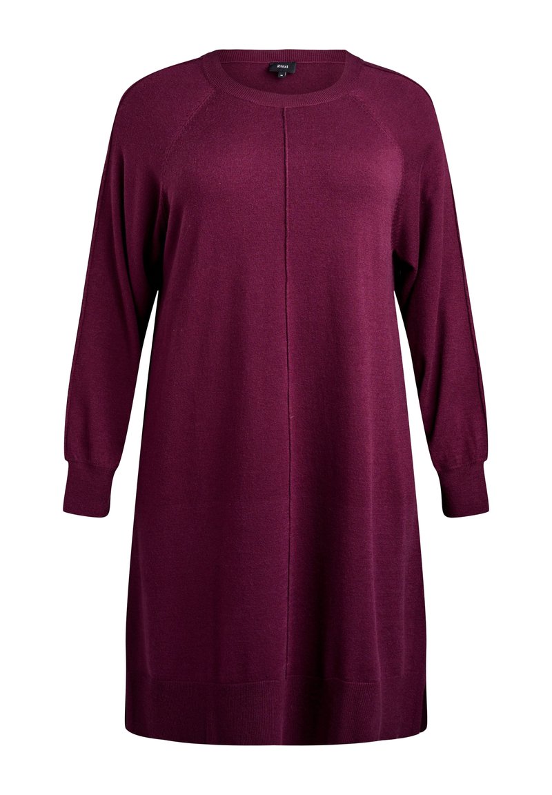 Robe à manches longues, longueur genou, dans un bordeaux profond avec un col rond et une coupe décontractée. Présente des poignets côtelés et un subtil détail de couture sur le devant.