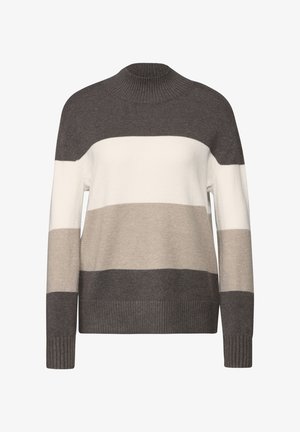 Strikket sweater i brune, beige og creme striber. Har en høj hals og ribbede manchetter med en løs pasform. Blød tekstur.