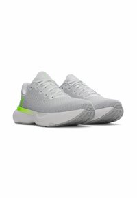 Light gray athletic shoes with a textured knit upper, green accents, and a chunky white sole showing tread detail.