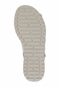 Šviesios spalvos batų padais su tekstūruotu sukibimo raštu, kuriame yra iškilūs stačiakampiai ir grioveliai. Paženklintas "CAPRICE" ir dydžiu "37."
