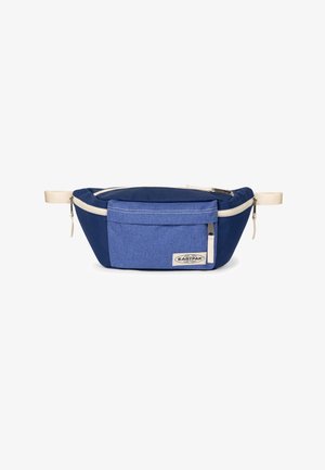 Riñonera Eastpak azul con bolsillo frontal, tiradores de cremallera beige y correas beige ajustables sobre fondo blanco.