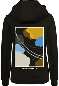 Black hoodie featuring a colorful abstract design in blue, yellow, gray, and tan with white lines. Text below reads "UNLIMITED SKILLS."