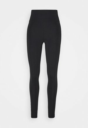 Schwarze Leggings mit einem hohen Bund, aus dehnbarem Stoff. Glatte Textur ohne sichtbare Muster oder Akzente. Vollständiges Design in voller Länge.