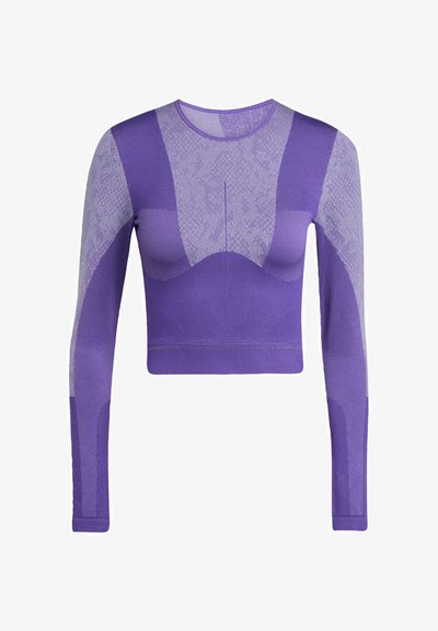 Top corto de manga larga morado con un patrón texturizado, que presenta un diseño ajustado y secciones de malla en contraste, fabricado con un material elástico.