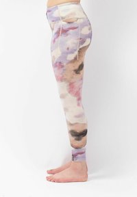 High-waisted leggings in soft, stretch fabric with a watercolor pattern in lavender, pink, and beige. Features a fitted design and ankle cuffs.