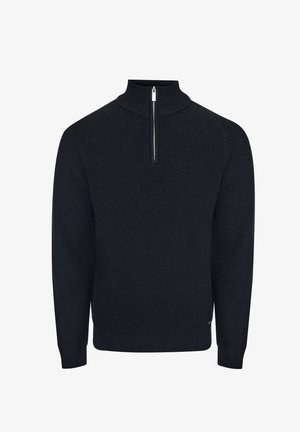 Donkerblauwe gebreide trui met een hoge kraag en een kwartritssluiting. Voorzien van een geribbelde textuur en versterkte schoudernaden.