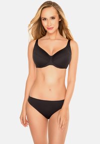 Reggiseno wireless nero con coppe lisce, spalline regolabili e cuciture minime; abbinato a un perizoma nero coordinato.