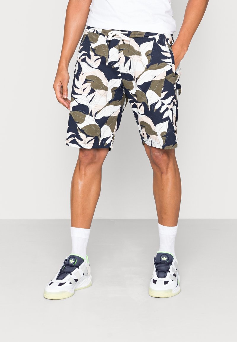 Shorts à motif floral en bleu marine, crème et olive. Fabriqués en tissu léger avec une ceinture élastique et des poches latérales.