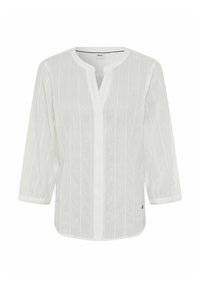Camicia bianca a manica lunga con scollo a V, motivo a righe verticali e una leggera texture. Chiusura con bottoni, orlo leggermente curvo e dettaglio con logo.