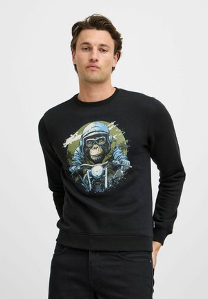 Black sweatshirt featuring a graphic of a monkey in a motorcycle helmet, with vibrant colors and splatter accents. Ribbed neckline and cuffs.