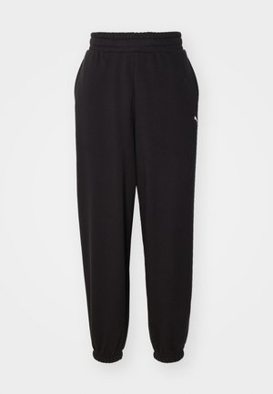 Schwarze Jogginghose aus weichem Stoff, mit einem gerippten Bund und elastischen Bündchen an den Knöcheln. Enthält ein kleines Logo-Detail an der Seite.