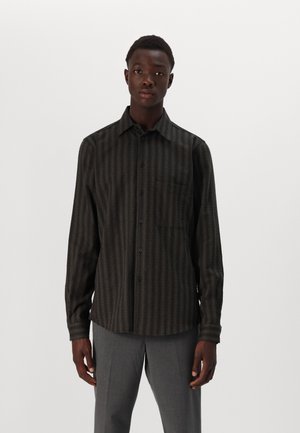 Long-sleeve shirt in dark green and black stripes, featuring a button-up front, collar, and single chest pocket. Textured fabric finish.
