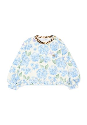 Haut bébé à manches longues blanc avec imprimé floral bleu, feuilles vertes, ourlet festonné, encolure imprimée léopard et deux boutons dorés sur l'épaule.