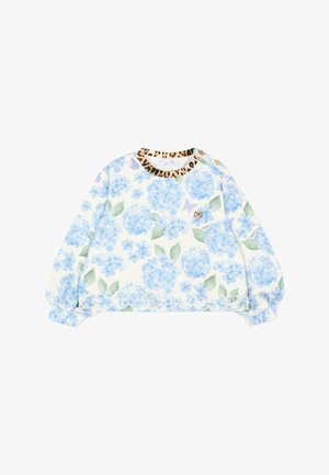 Top bianco per bebè a manica lunga con stampa floreale blu, foglie verdi, orlo smerlato, scollo con stampa leopardata e due bottoni dorati sulla spalla.