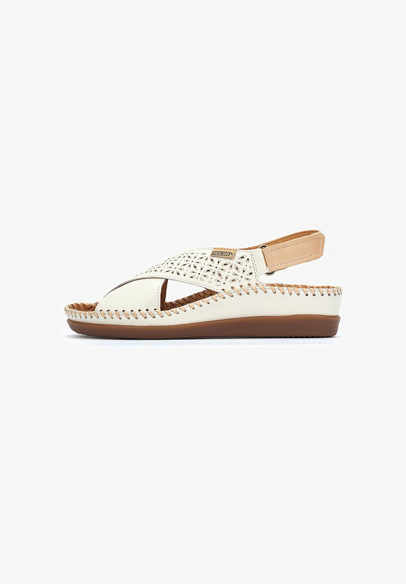 Weiße Ledersandalen mit durchbrochenem Blumenmuster, braunen Akzenten und brauner Gummisohle. Verfügt über einen verstellbaren Riemen für einen sicheren Sitz.