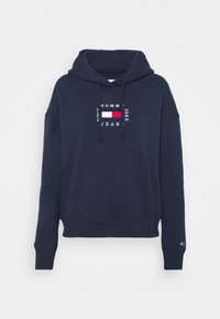 Sweat-shirt bleu marine en coton, doté d'une poche frontale, d'une capuche avec cordon de serrage et d'un logo brodé en rouge, blanc et bleu.